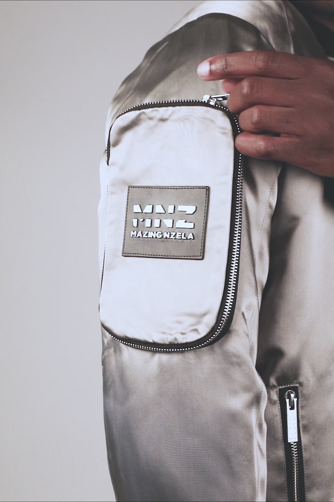 Men's bomber jacket with cargo pockets and convertible crossbody bag grey